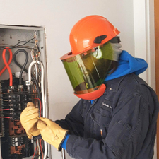 residential electricians installing a new outlet in a kitchen