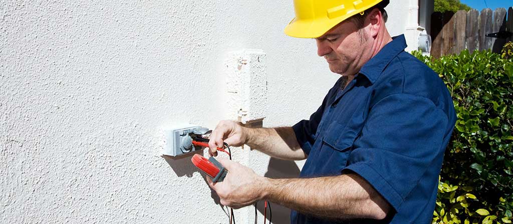 licensed electrician performing external electrical home repair near me